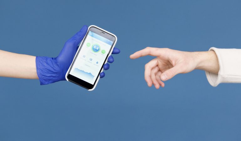 Hand of patient reaching for smartphone with health app offered by hand of doctor wearing blue glove