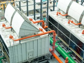 Sets of cooling towers in data center building