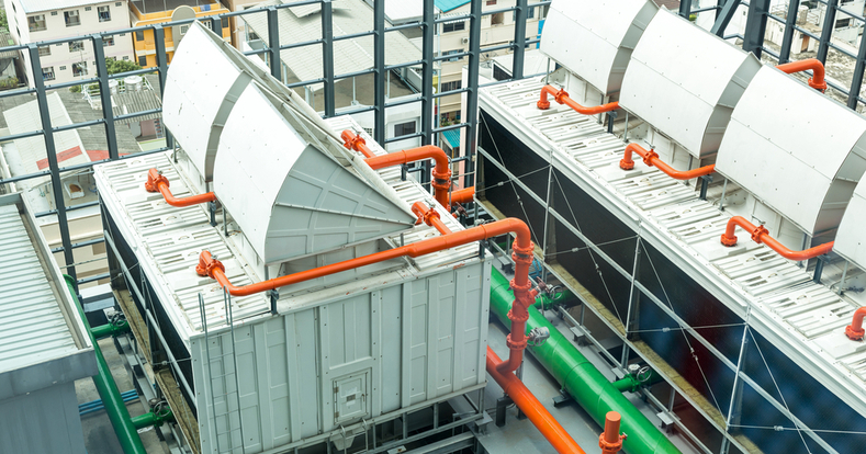 Sets of cooling towers in data center building