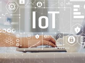 IoT with woman using a laptop on a coffee table