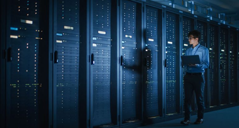 Data Center Engineer Using Laptop Computer