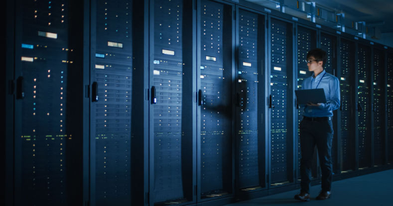 Data Center Engineer Using Laptop Computer