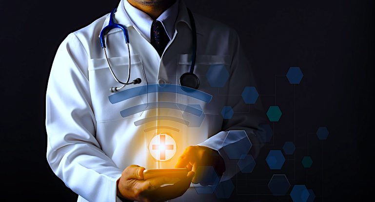 Doctor in white coat is using a WiFi connection